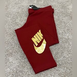 NWT - Nike Running Leggings - Sz L - Red color with foil gold logo on lower leg